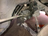 Prying Front Bushing Lip with Screwdriver.jpg